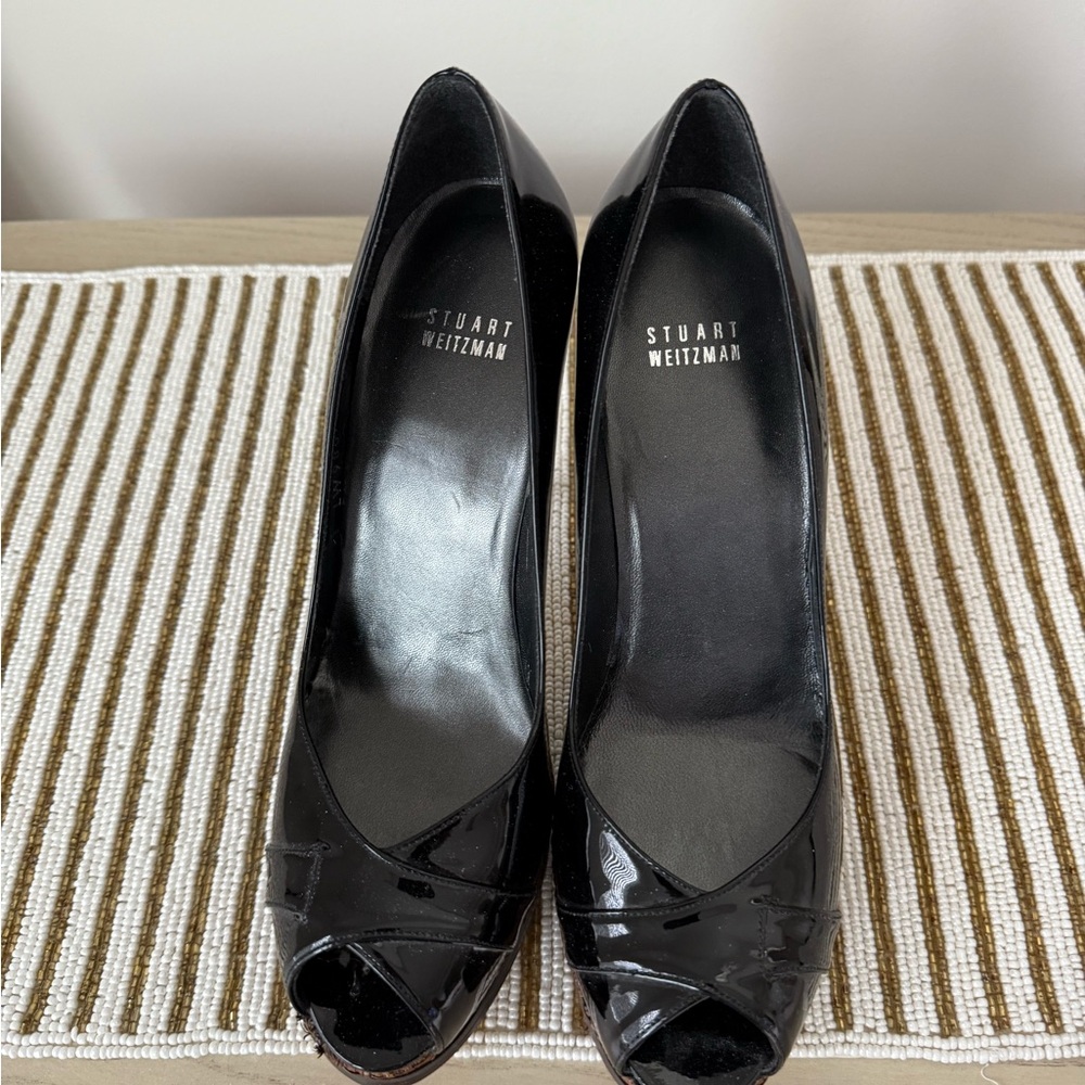 Stuart Weitzman 
Peep toe black patent leather heal